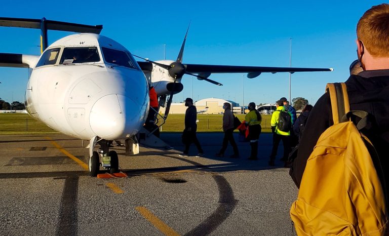 People boarding a charter airplane for the Natural Resources Sector.