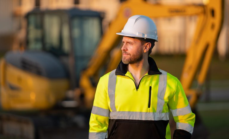Worker,In,Helmet,On,Site,Construction.,Excavator,Bulldozer,Male,Worker.