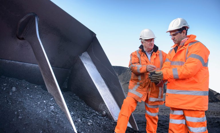 Workers,Inspecting,Coal,At,Surface,Coal,Mine